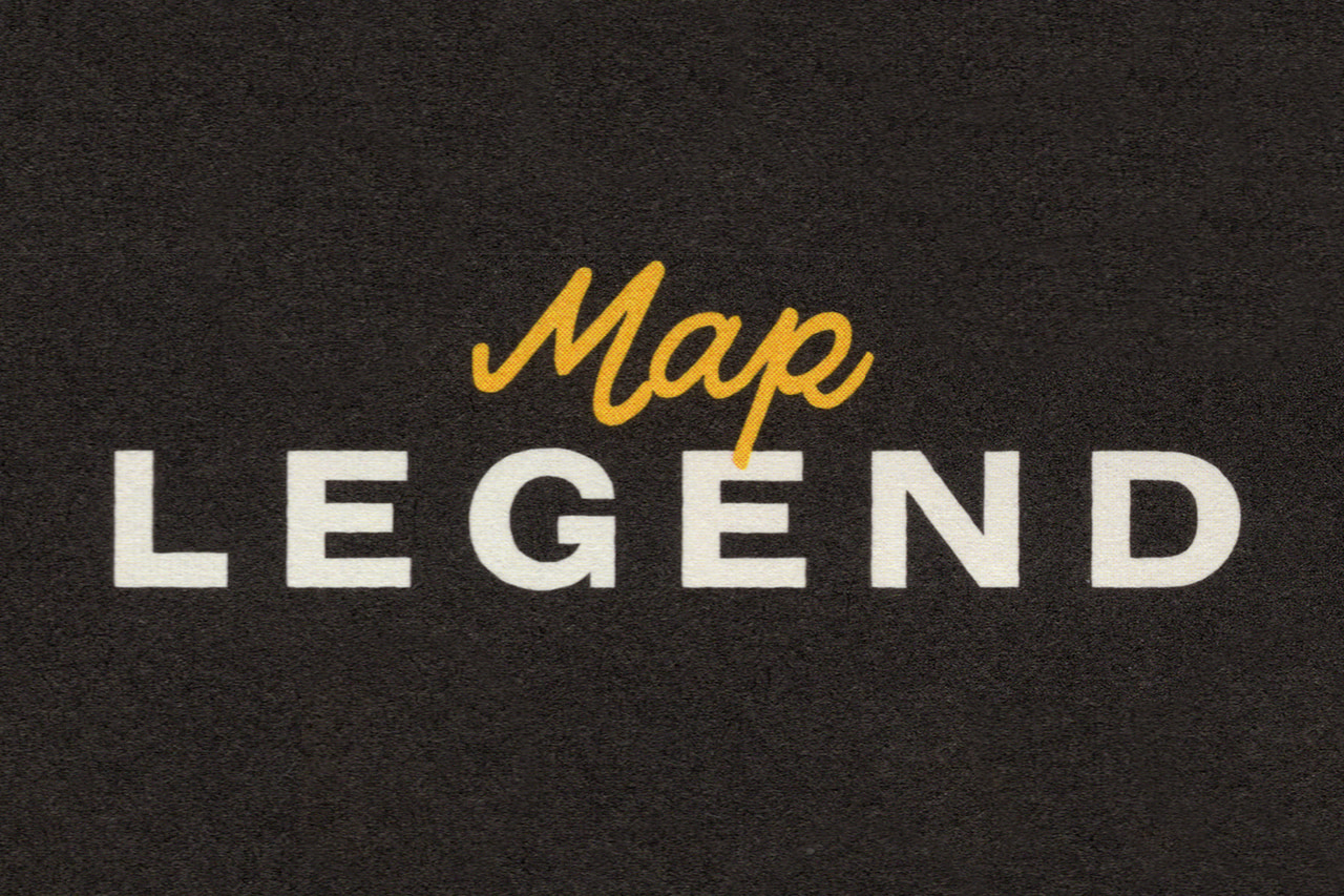 Map Legend in yellow script and widely spaced cream letters on a dark textured background.