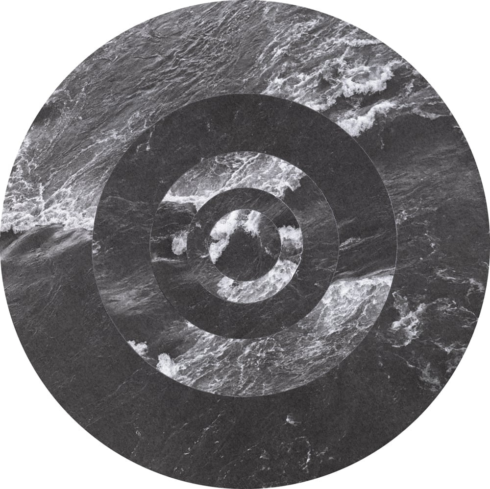 Circular black-and-white water-texture collage interrupted by dark concentric rings and small bright fragments.