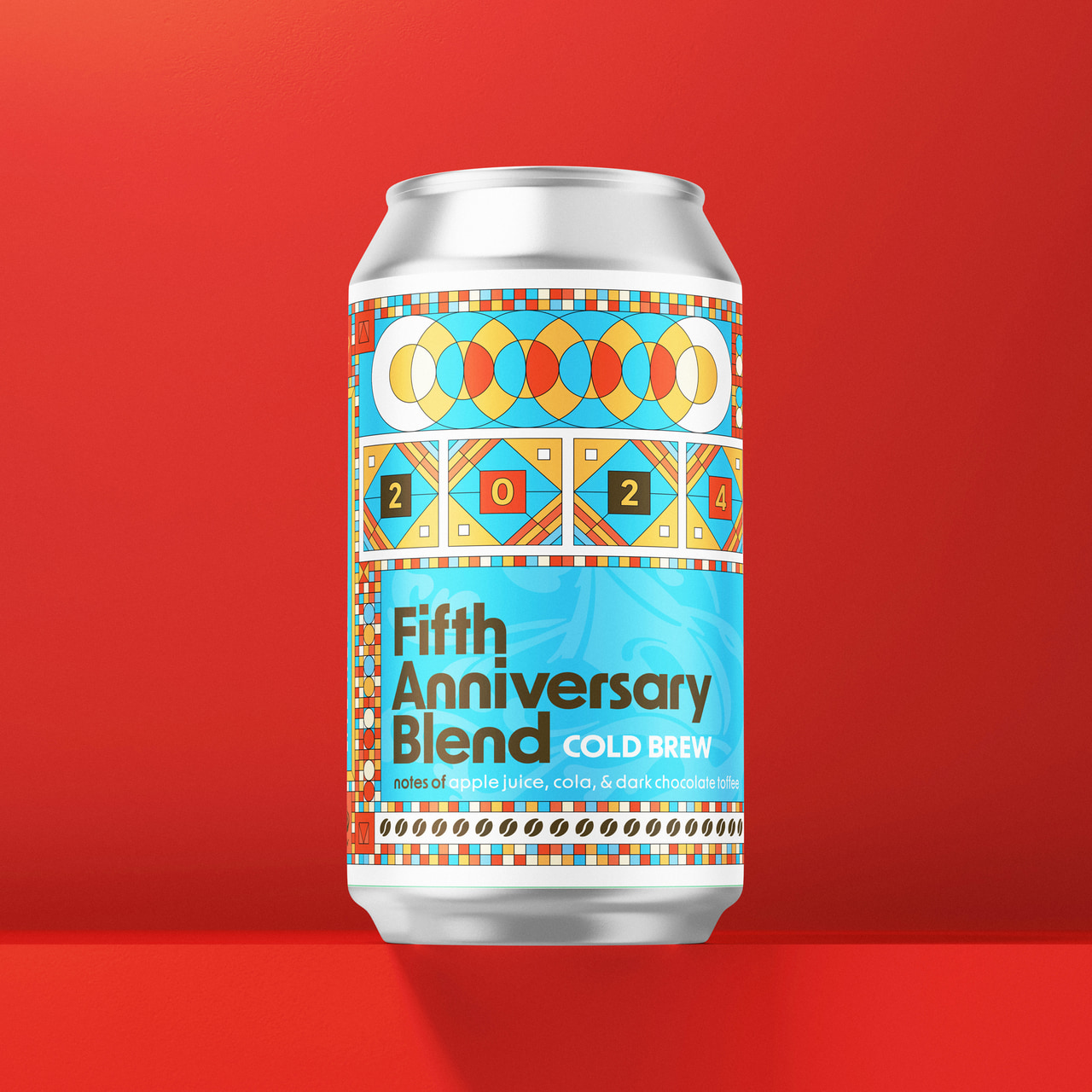 Tree House Fifth Anniversary Blend cold-brew can with colorful geometric borders, blue lettering and the numerals 2024, on red.