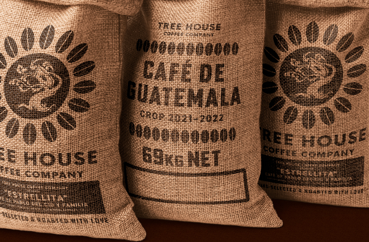 Burlap coffee sacks printed with ornamental Tree House Coffee Company marks and Café de Guatemala lettering.