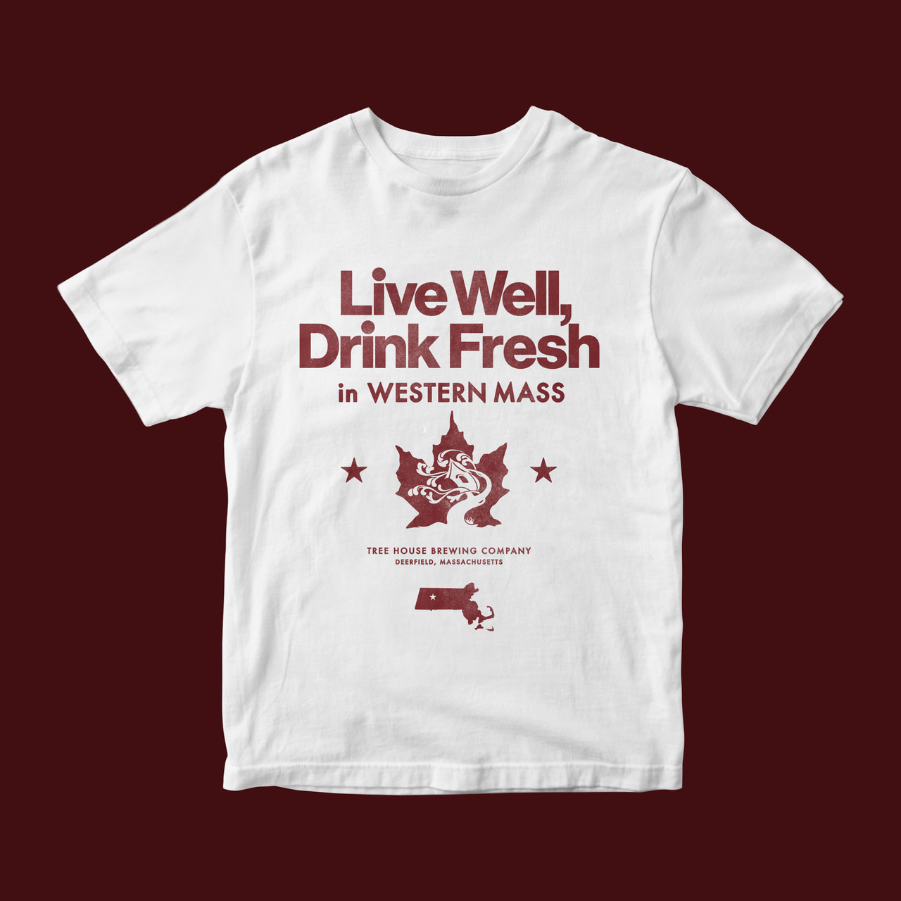 White T-shirt with burgundy Live Well, Drink Fresh in Western Mass lettering, an ornamental tree, stars and Massachusetts silhouette, on burgundy.