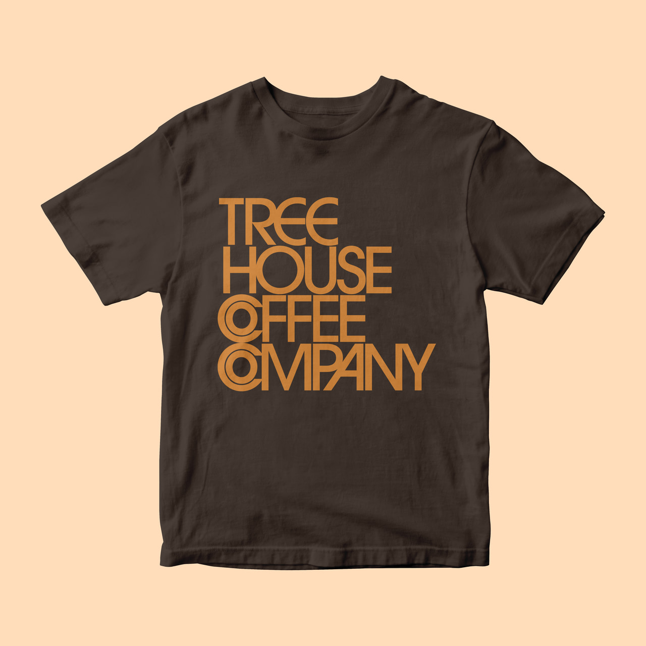 Brown T-shirt with stacked orange Tree House Coffee Company geometric lettering, on cream.