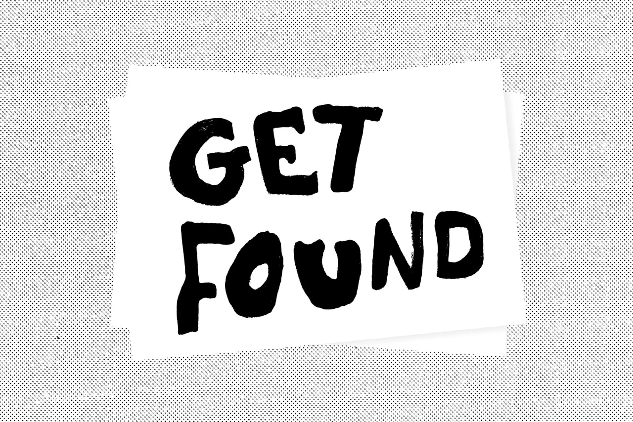 White paper with black brush-stroke text on a halftone dot background.