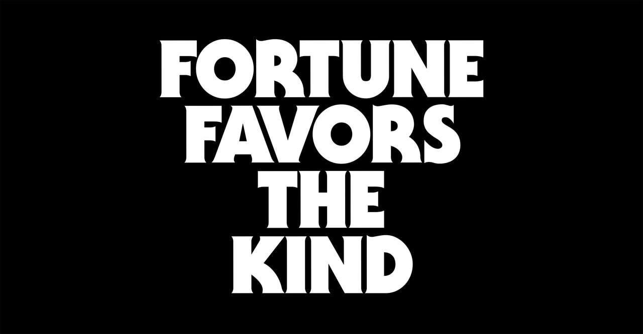 Fortune favors the kind, in four lines of bold white lettering on black.