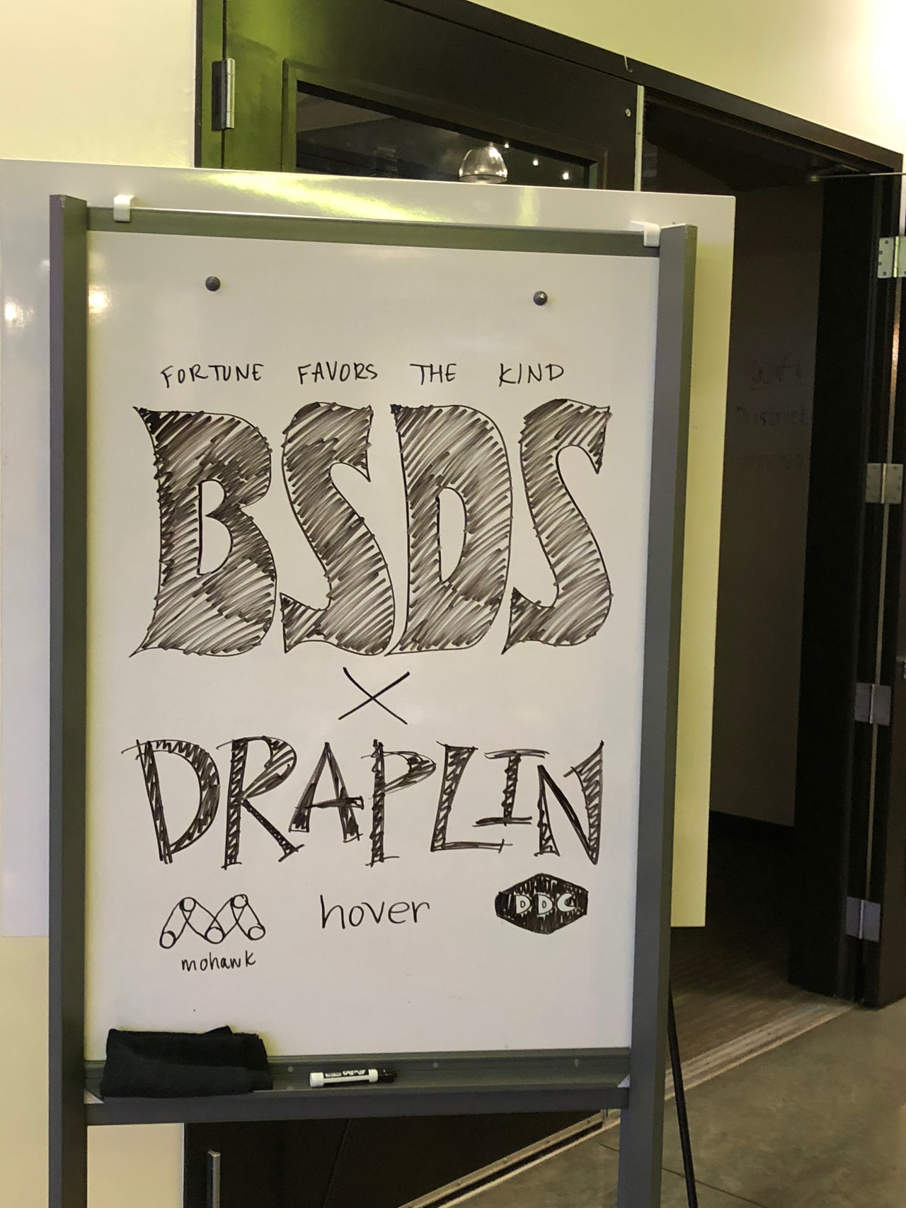 Hand-lettered whiteboard reading Fortune favors the kind, BSDS × Draplin, with Hover and DDC marks below.