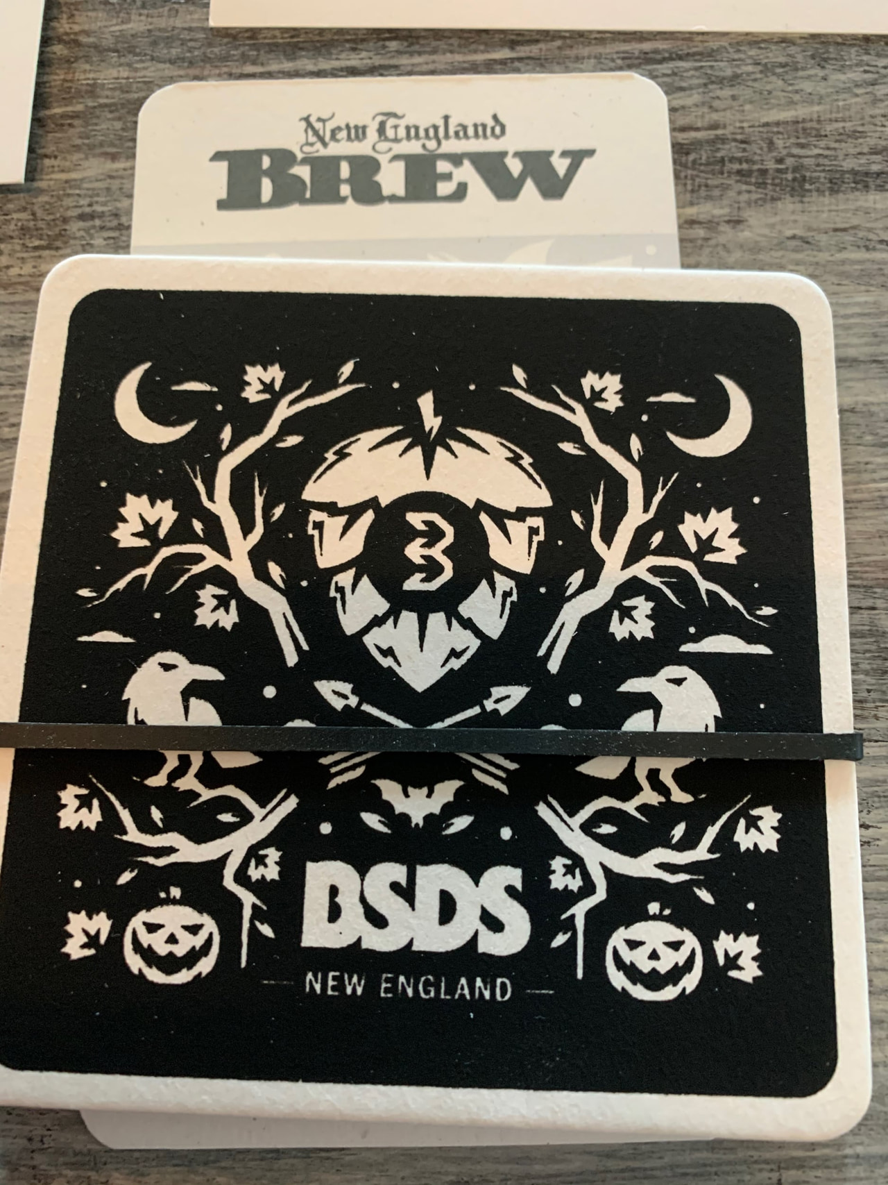 Two black-and-cream printed BSDS cards with ornamental trees, stars, crescent moons and New England lettering.