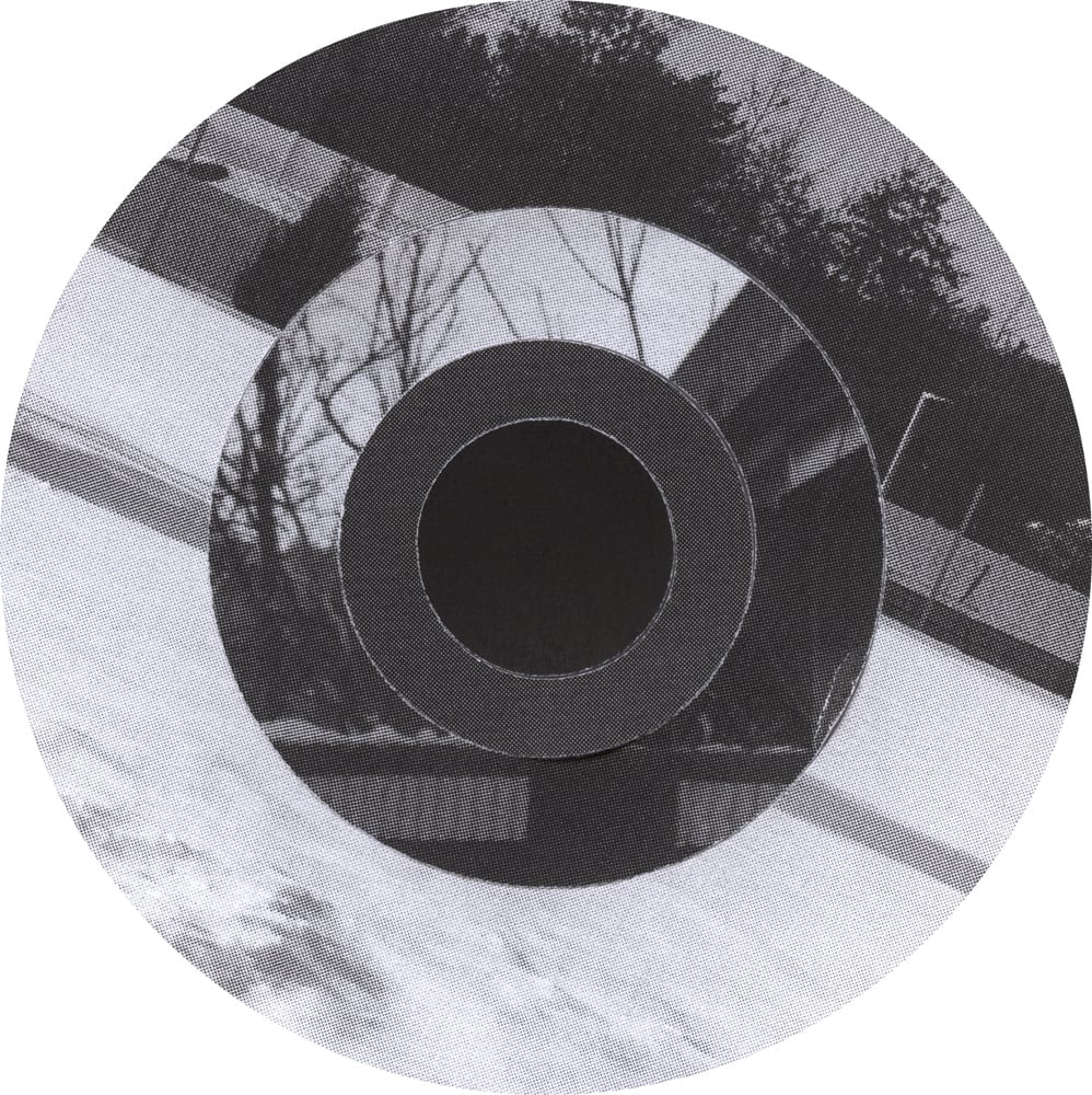 Circular black-and-white collage combining horizontal siding, bare branches and dark concentric rings.