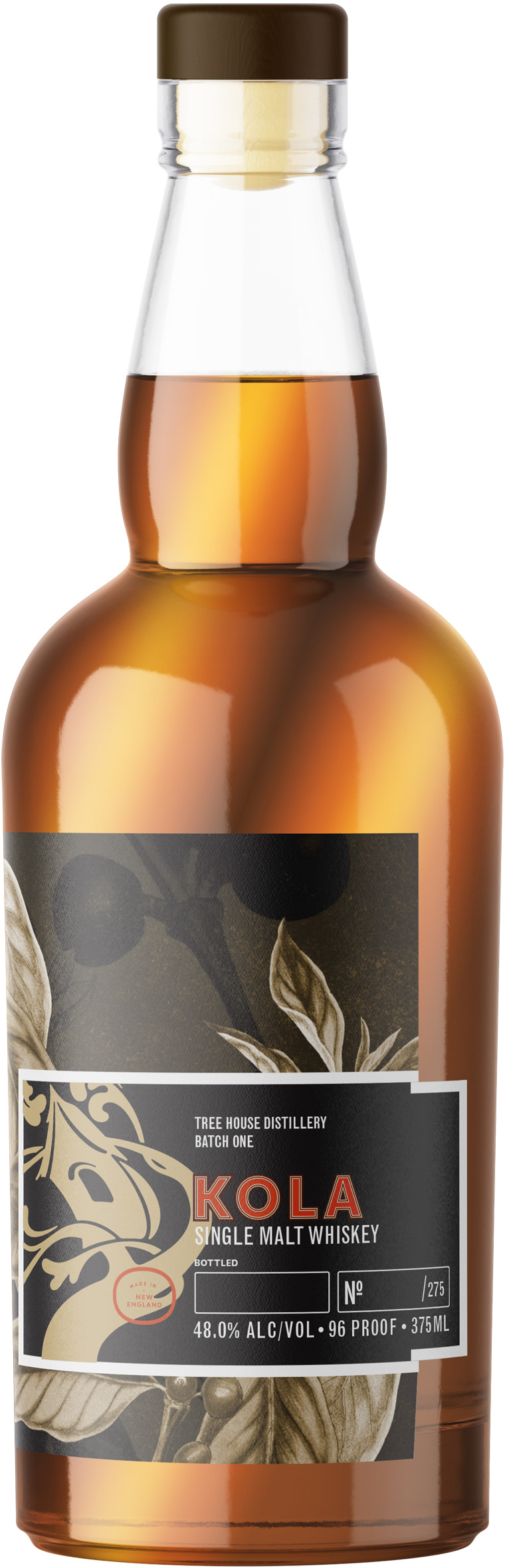 Amber whisky bottle with a black Kola label featuring cream ornamental tree and leaf artwork.