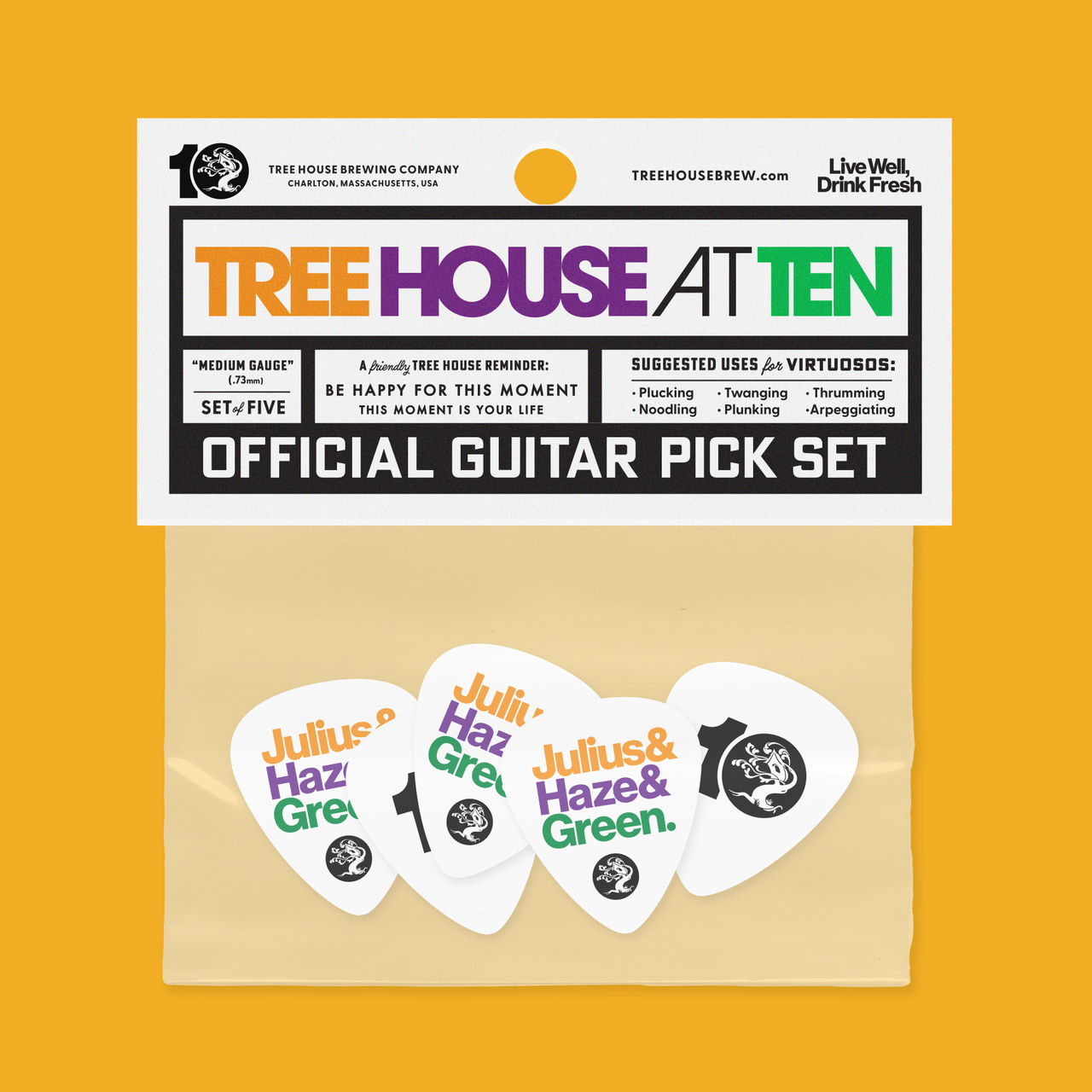 Tree House at Ten official guitar-pick-set packaging displaying three picks with colored lettering and ornamental tree marks, on yellow.