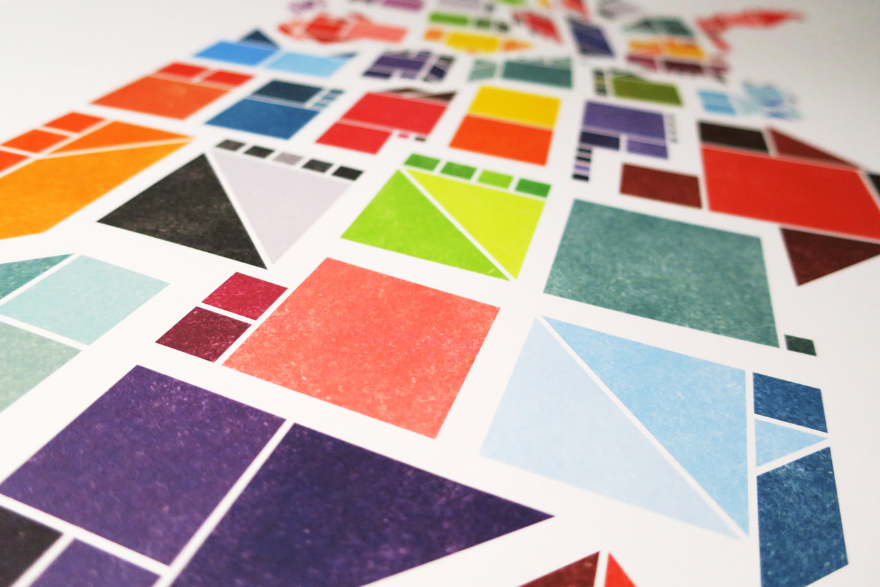 Close-up view across a Tangram States print with colorful textured geometric shapes.